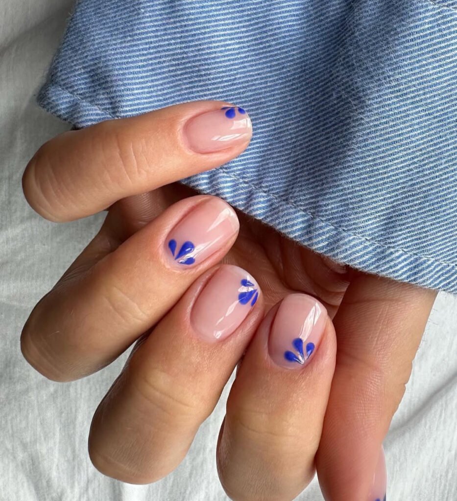 nude nails with navy blooms