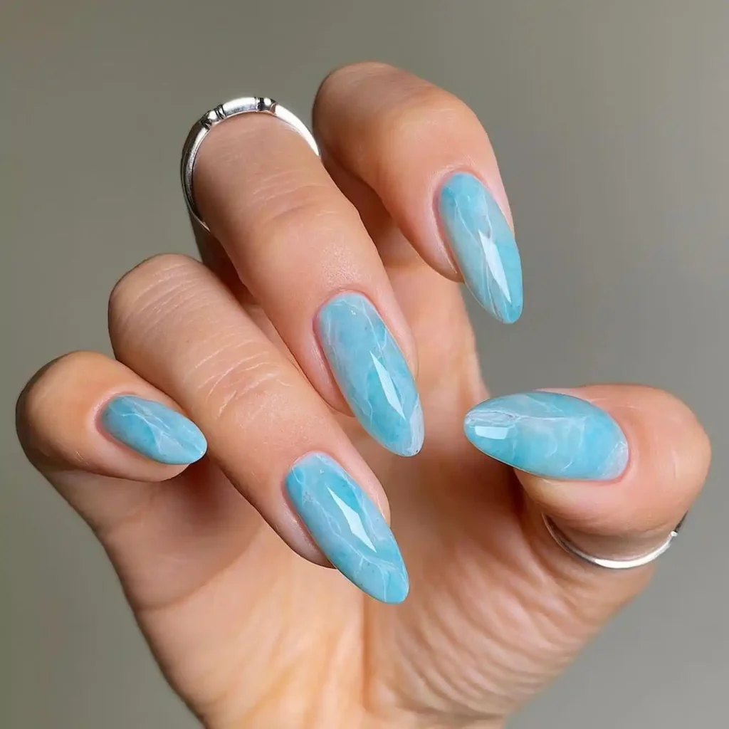 Light blue Marble beach nail ideas